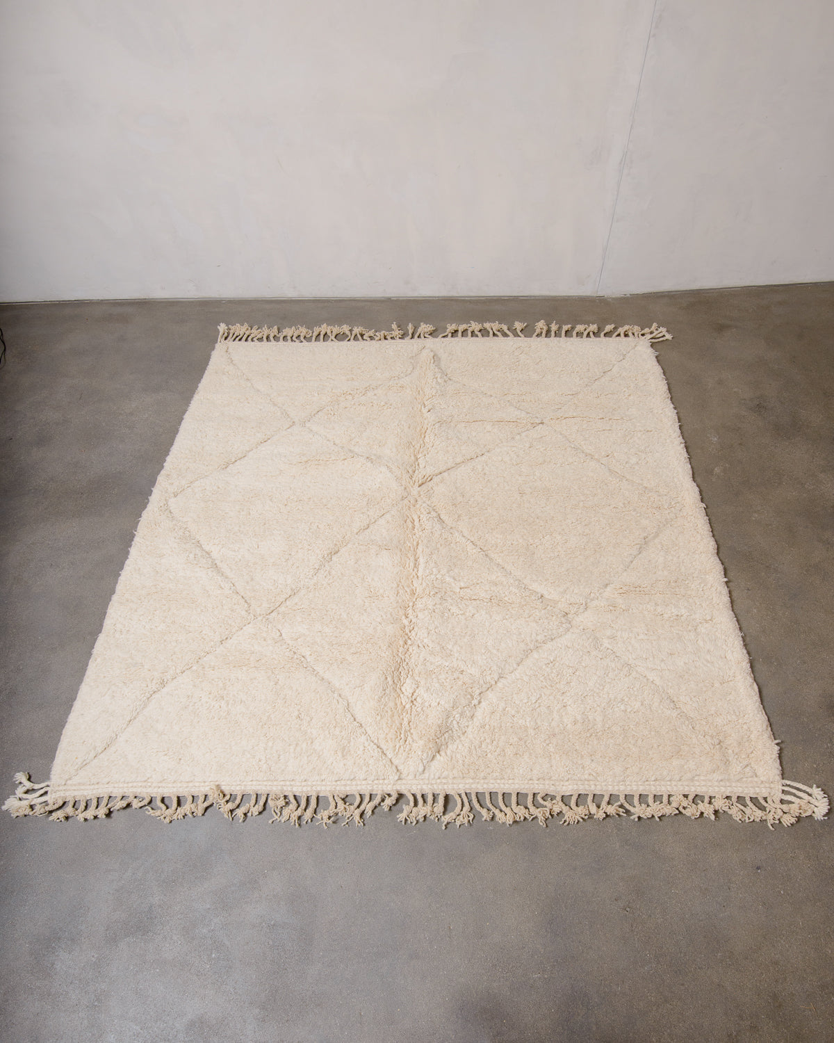 Modern, designer, handcrafted Berber rug from Morocco. Beniourain carpet with minimalist design, natural wool pile and a fluffy texture.